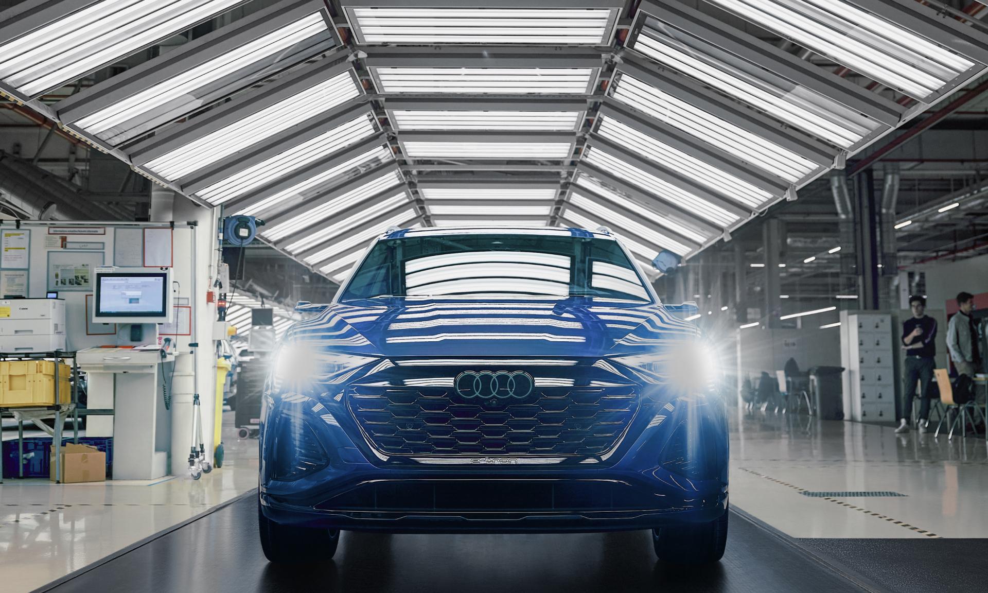 A finished Audi Q8 e-tron being quality checked.