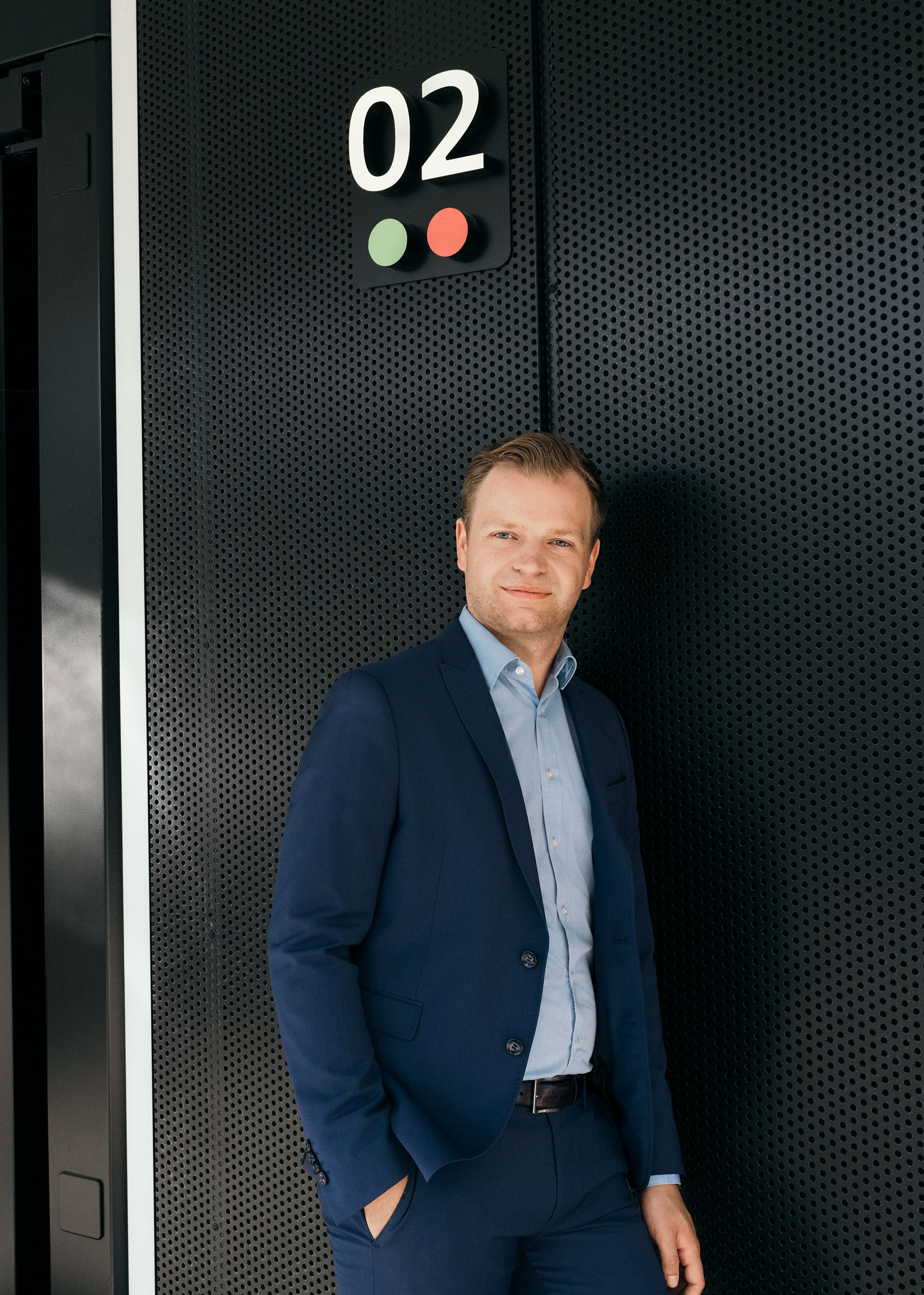 Project Consultant for Decarbonisation Strategy Malte Vömel in front of the Audi charging hub.