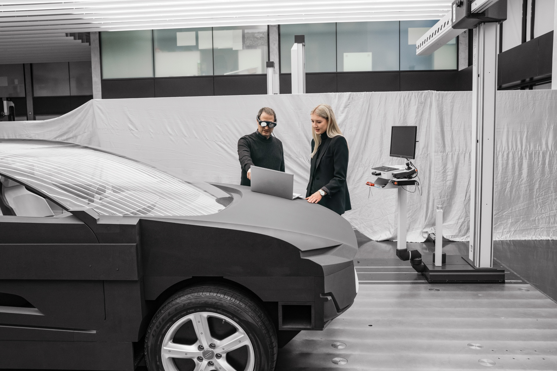 Jan, Christina and the mock-up inside a room for vehicle development.