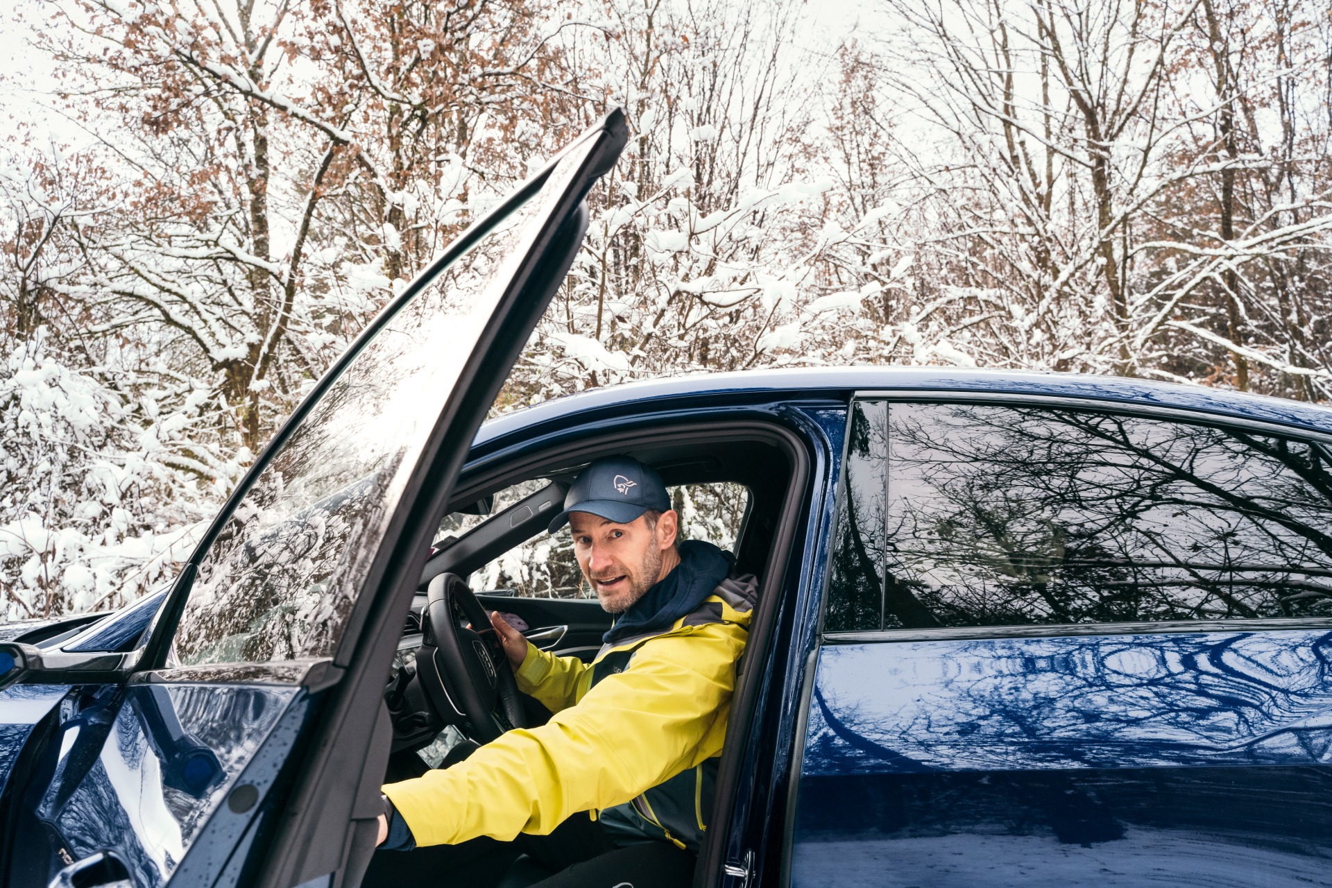 Portrait of Sebastian Copeland in his Audi e-tron.