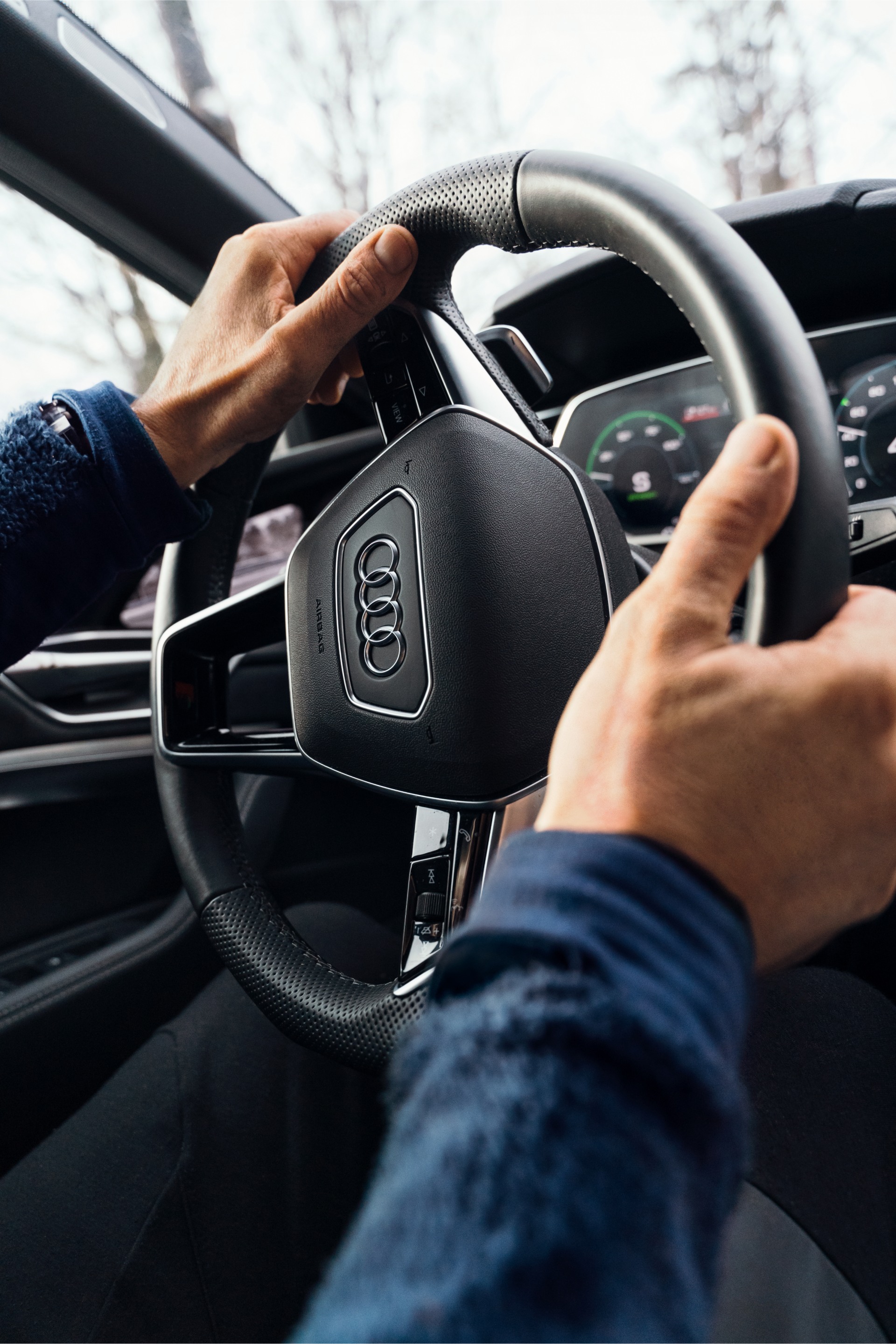 Close-up of Copeland’s hands while driving his car.