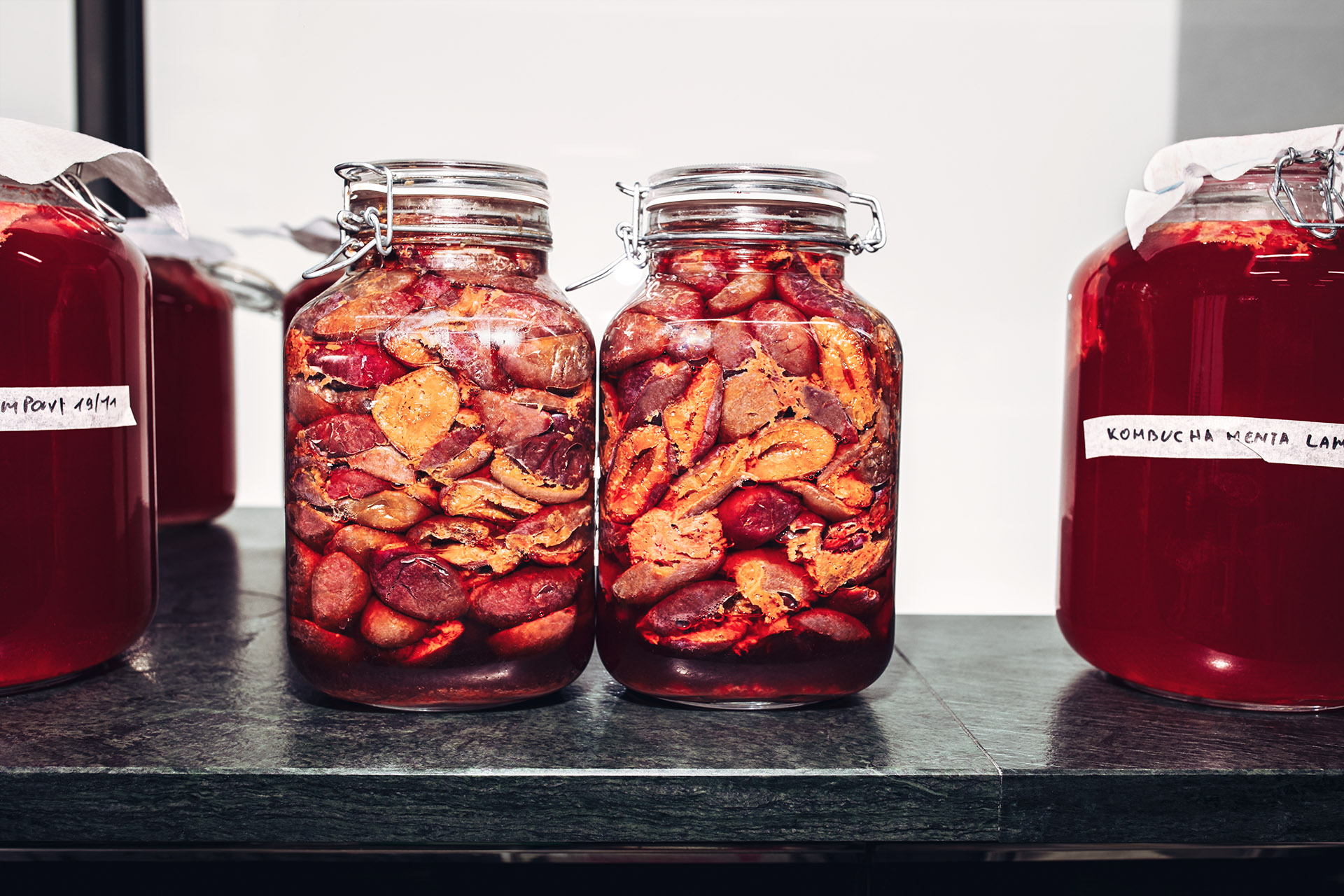 Plums in mason jars.