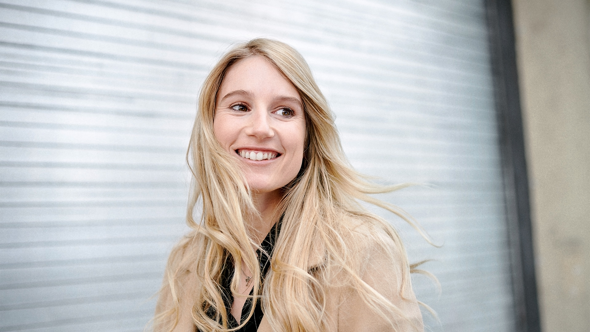 Portrait of Anna Gasser in front of blurred, outdoor background.