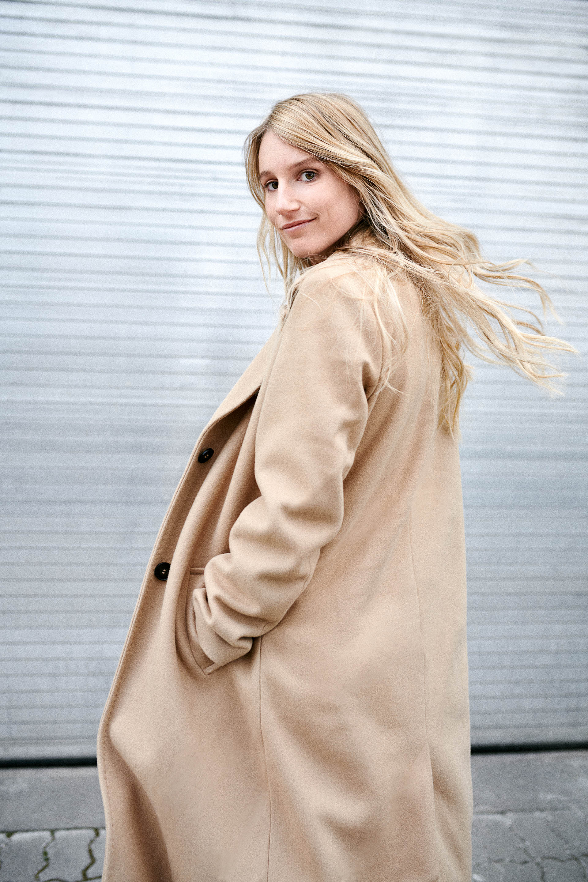 A medium shot of Anna Gasser looking over her shoulder at the camera.