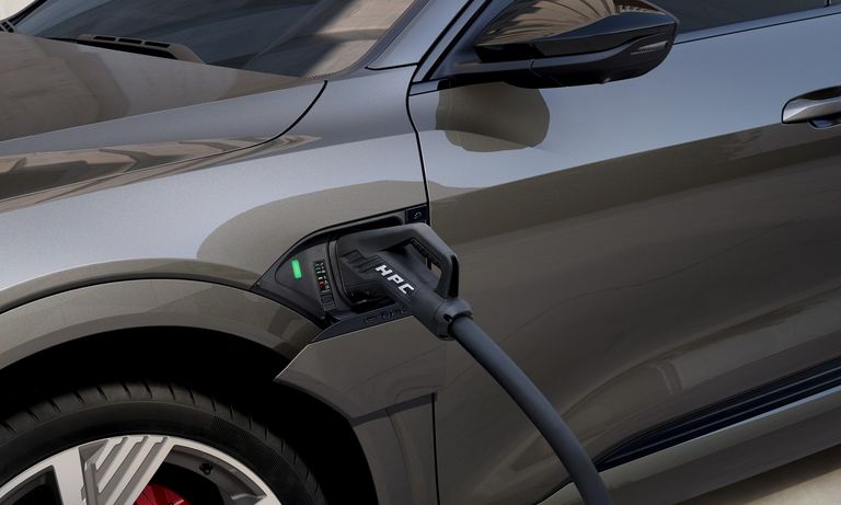 A high-power charging cable connected to the Audi Q8 e-tron